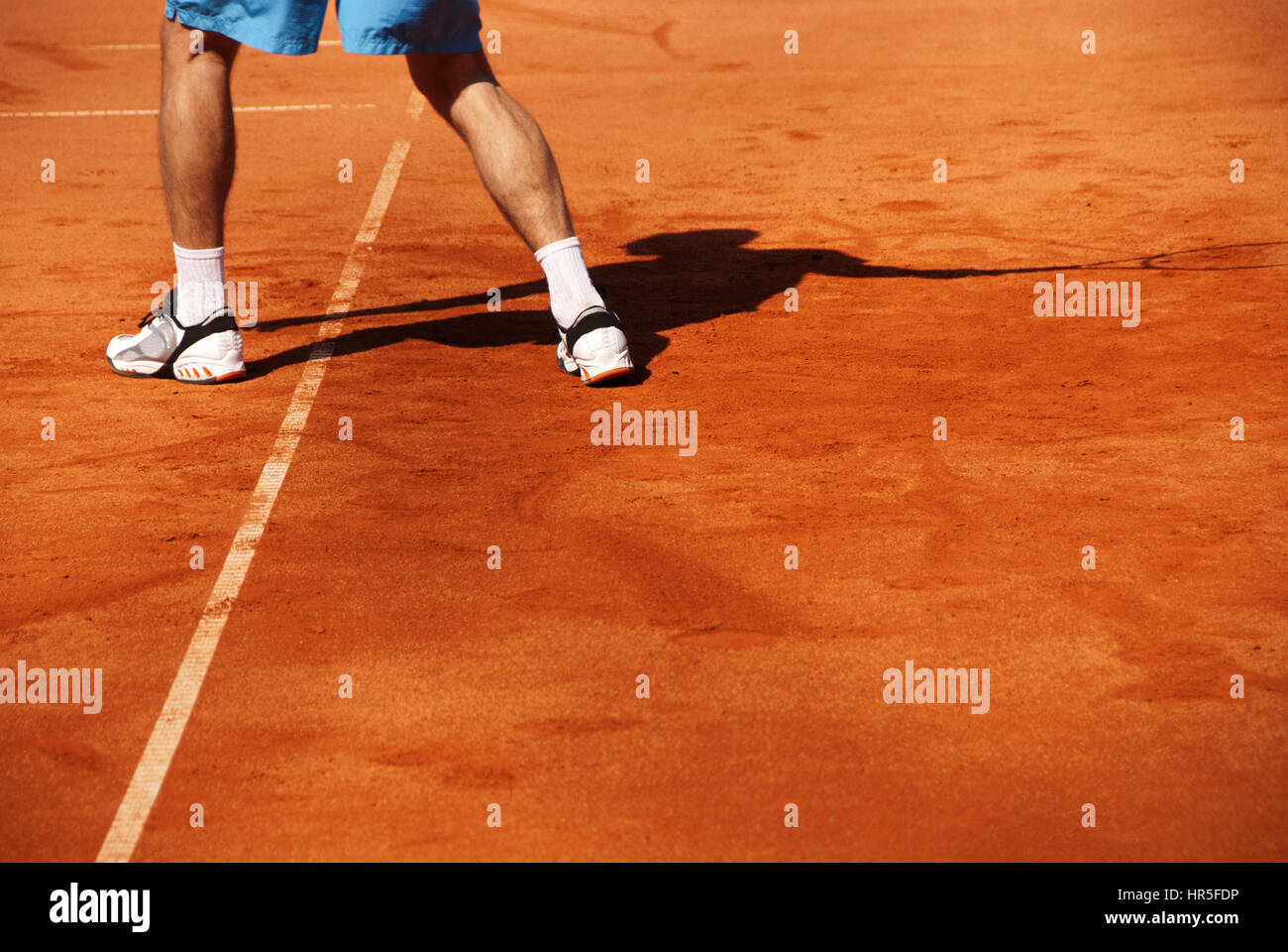 tennis player legs and shadow Stock Photo Alamy