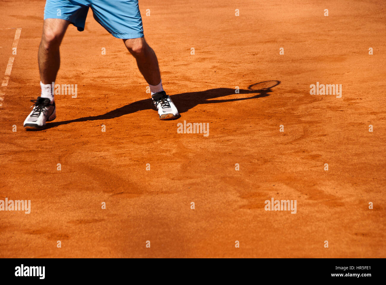 tennis player legs and shadow Stock Photo Alamy
