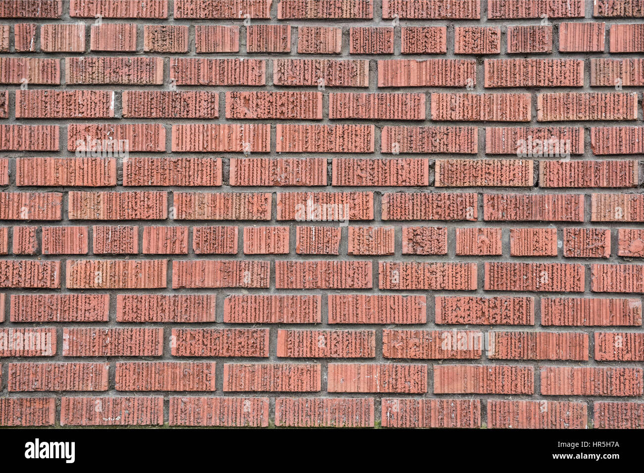 Red wire cut brick wall Stock Photo - Alamy