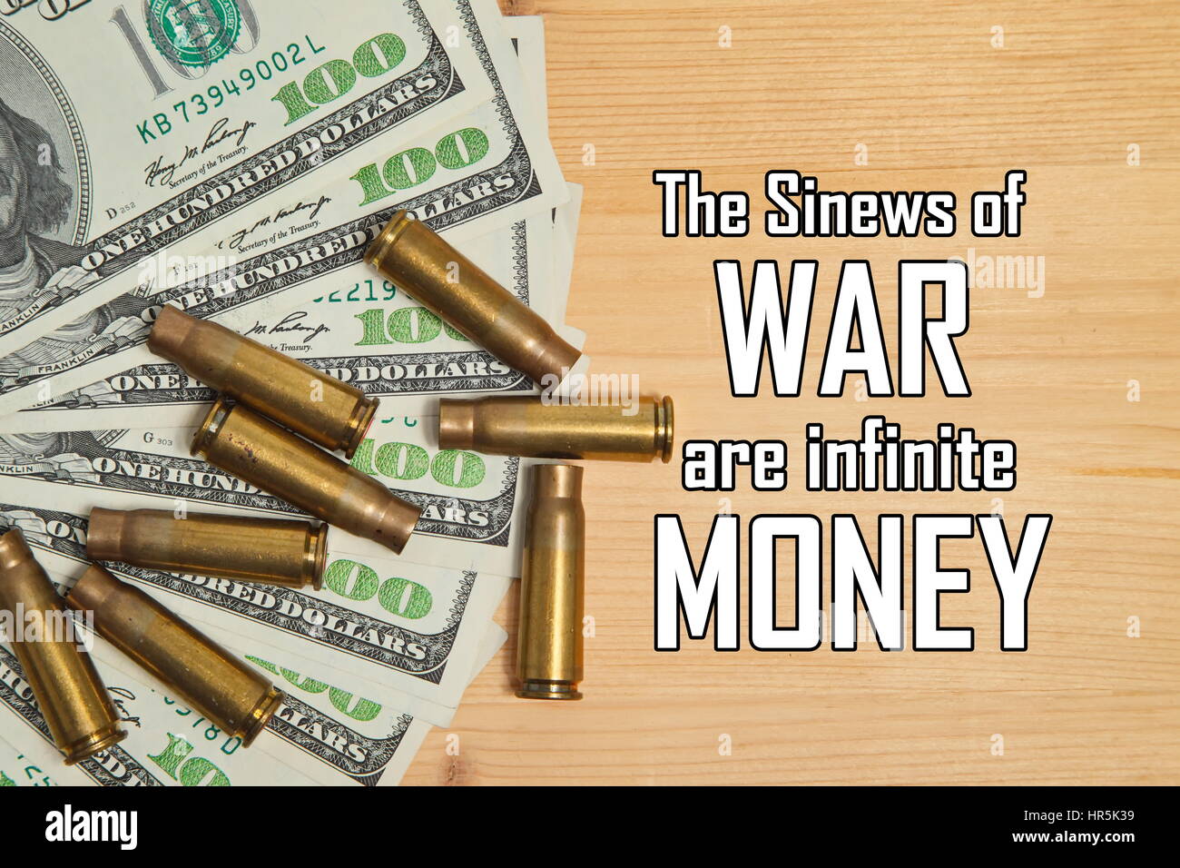 Bullet shells and dollars with message 'The Sinews of War are infinite Money' Stock Photo