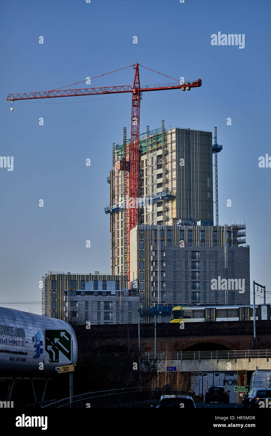 Blue sky sunny day tower cranes Castlefield Salford boundary Manchester skyline , England,UK Stock Photo