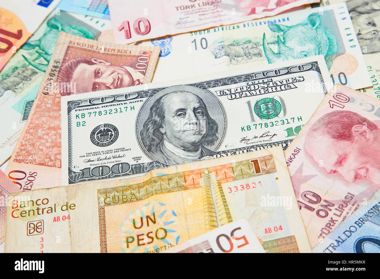 Background from paper money of the different countries. American dollars in the middle Stock Photo