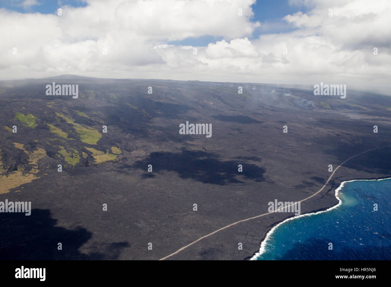 Aerial shot of volcanic fumes rising from the slopes of the active volcano Kilauea on Big Island, Hawaii, USA. Stock Photo