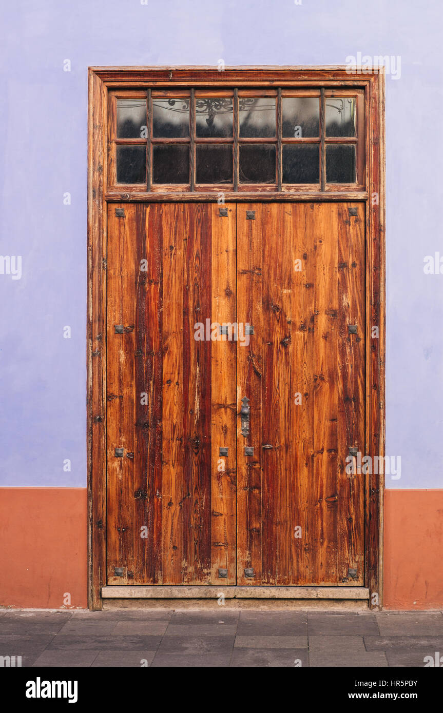 Outdoor wooden varnished orange door, vertical view Stock Photo Alamy