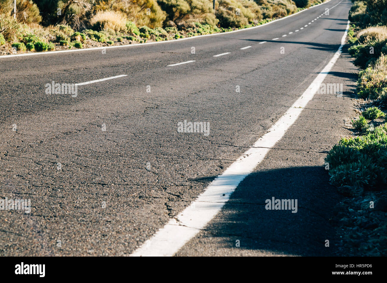 Empty desert road, perspective view with selective focus Stock Photo