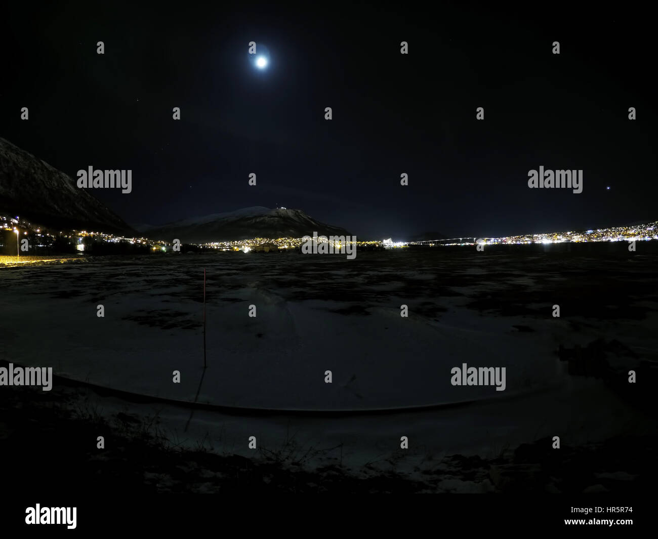 aurora borealis at night in tromsoe city with full moon Stock Photo Alamy