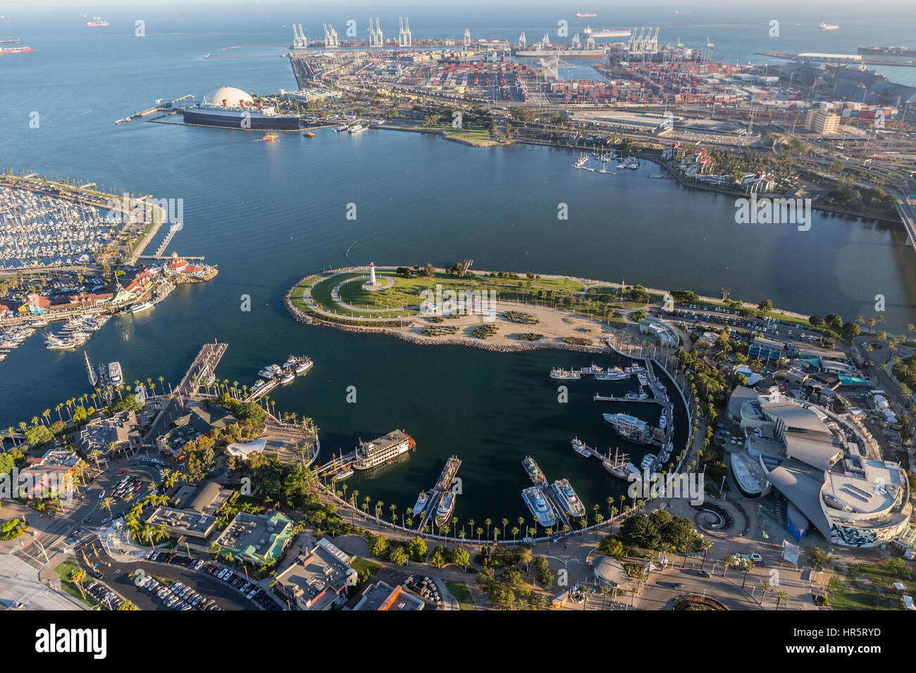 Long Beach, California, USA - August 16, 2016:  Afternoon aerial view of Rainbow Harbor, tour ships, aquarium and Queen Mary attractions. Stock Photo