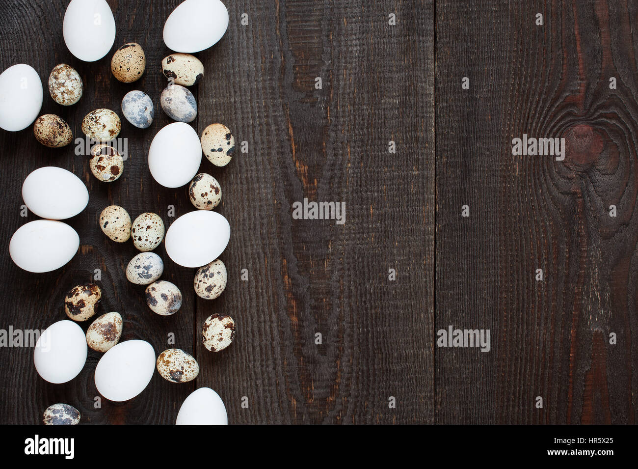 Wooden background with various chicken and quail eggs Stock Photo - Alamy