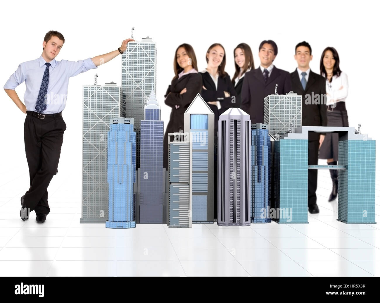 business man facing the camera with his team behind him Stock Photo - Alamy