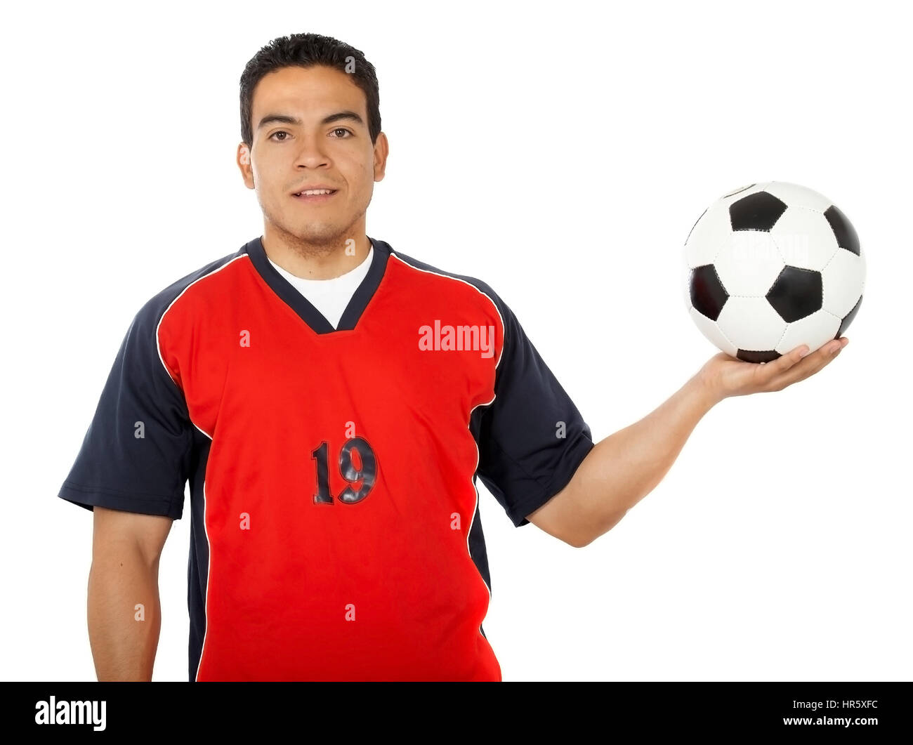 male footballer standing up isolated over a white background Stock Photo