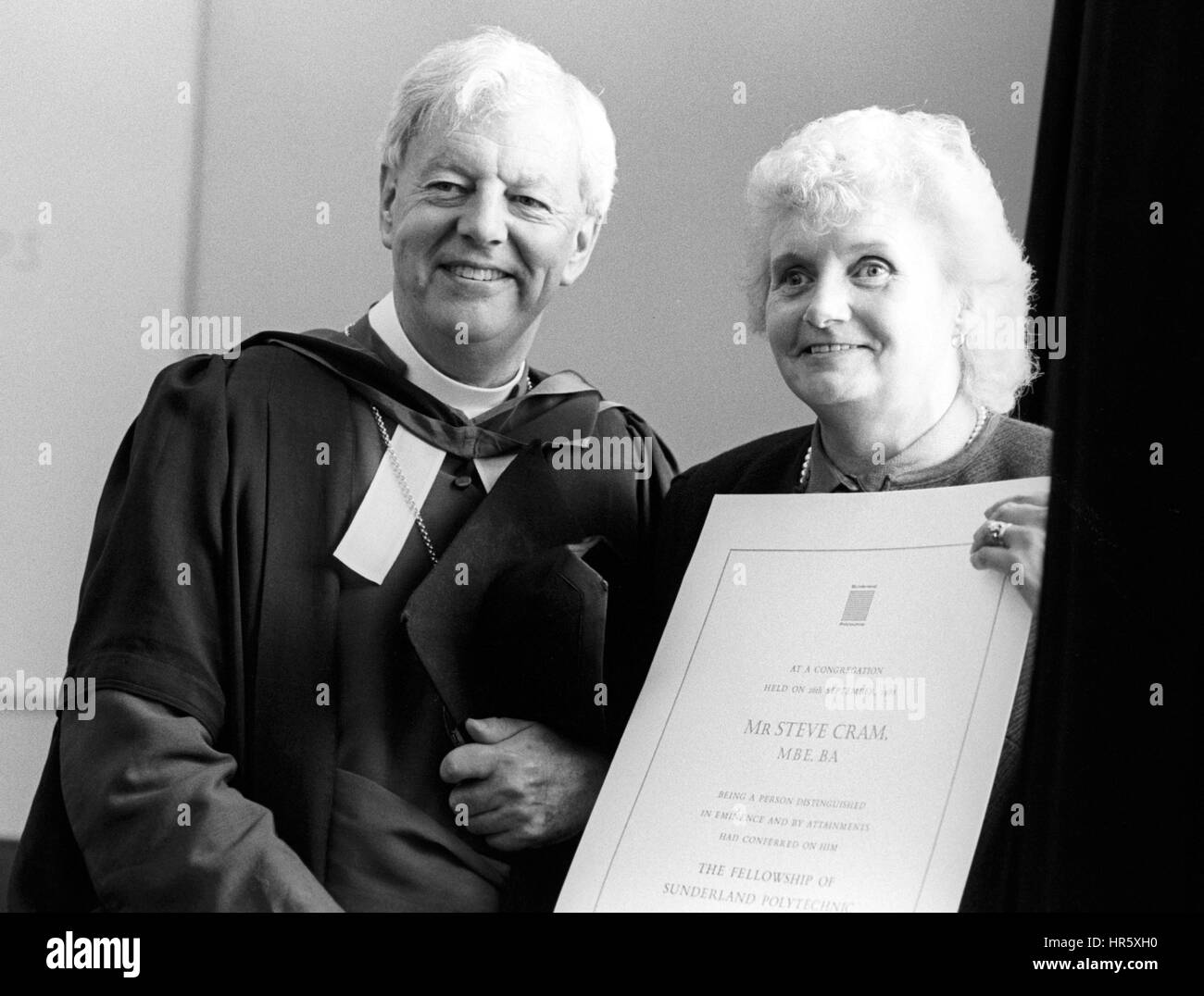 The Bishop of Durham, the Right Reverend David Jenkins and Mrs Maria Cram collecting Honorary Fellowships at the Sunderland Polytechnic. Mrs Cram, mother of athlete Steve Cram, was collecting the award on behalf of her son who was in Paris. Stock Photo