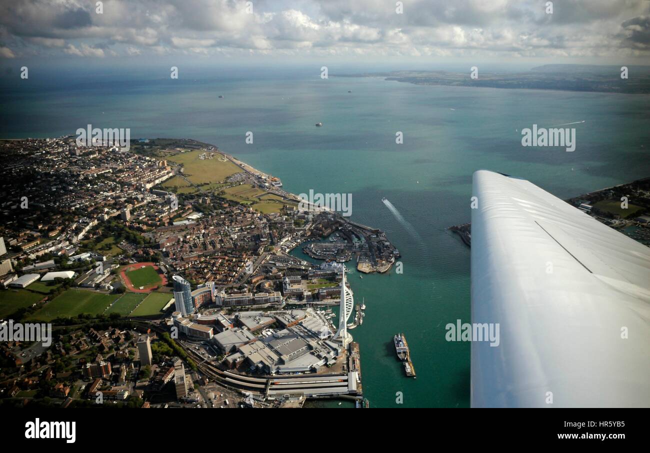 AJAXNETPHOTO. -  24TH AUGUST, 2011. PORTSMOUTH, ENGLAND. - AERIAL VIEW OF HARBOUR ENTRANCE WITH SPINNAKER TOWER LOWER CENTRE, SOUTHSEA AND THE SOLENT BEYOND.  PHOTO:JONATHAN EASTLAND/AJAX REF:R110709 2124 Stock Photo