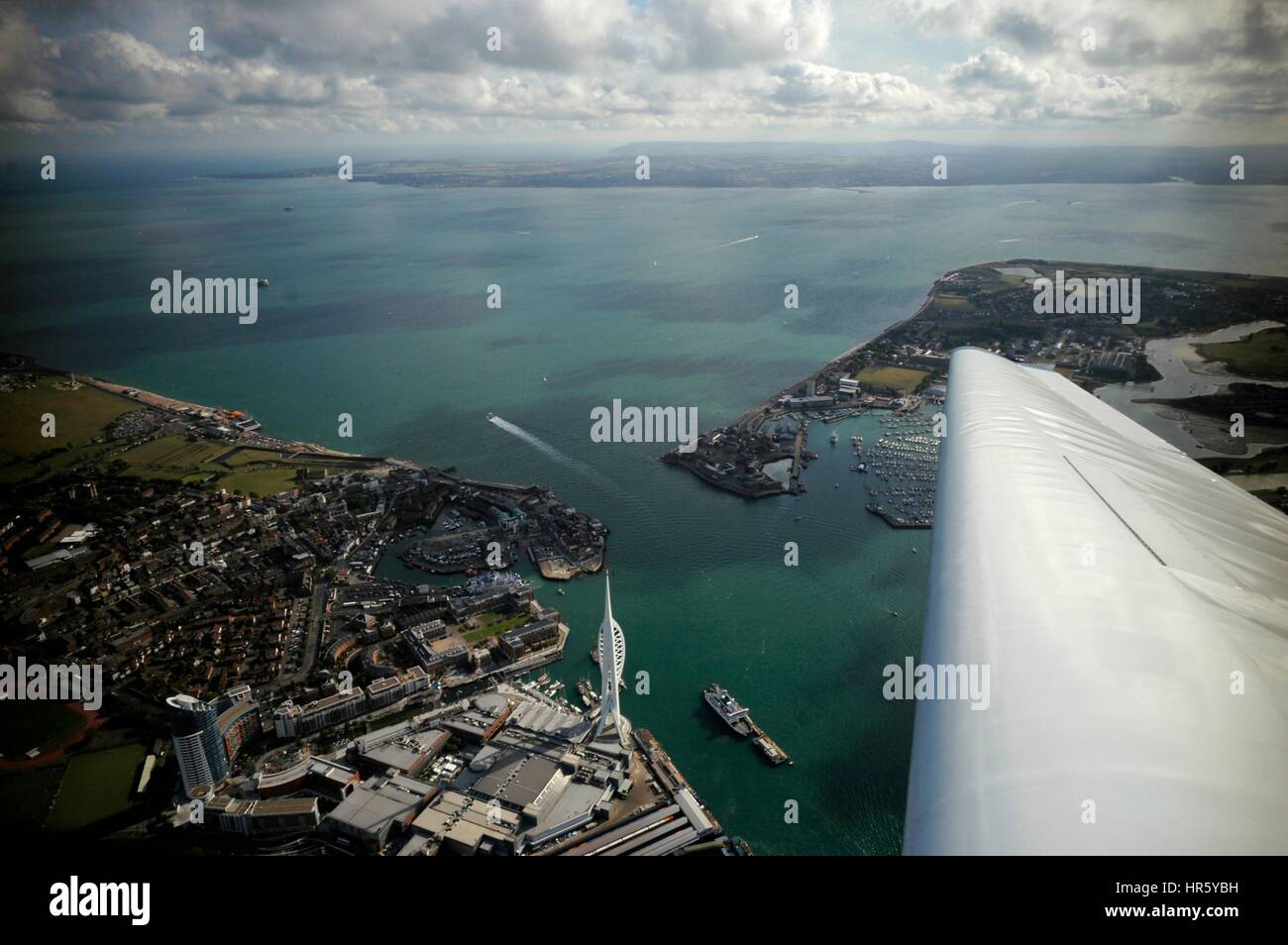 AJAXNETPHOTO. -  24TH AUGUST, 2011. PORTSMOUTH, ENGLAND. - AERIAL VIEW OF HARBOUR ENTRANCE WITH SPINNAKER TOWER LOWER CENTRE, SOUTHSEA AND THE SOLENT BEYOND.  PHOTO:JONATHAN EASTLAND/AJAX REF:R110709 2126 Stock Photo