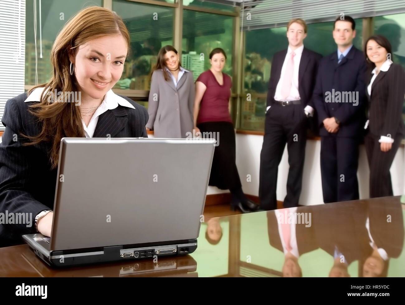 Business woman and her team in an office Stock Photo - Alamy