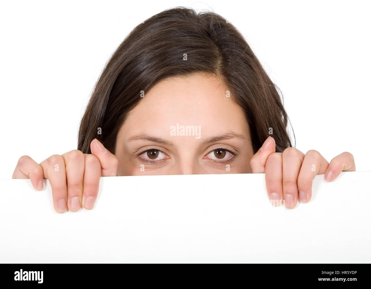 girl appearing over a cardboard isolated over a white background Stock ...