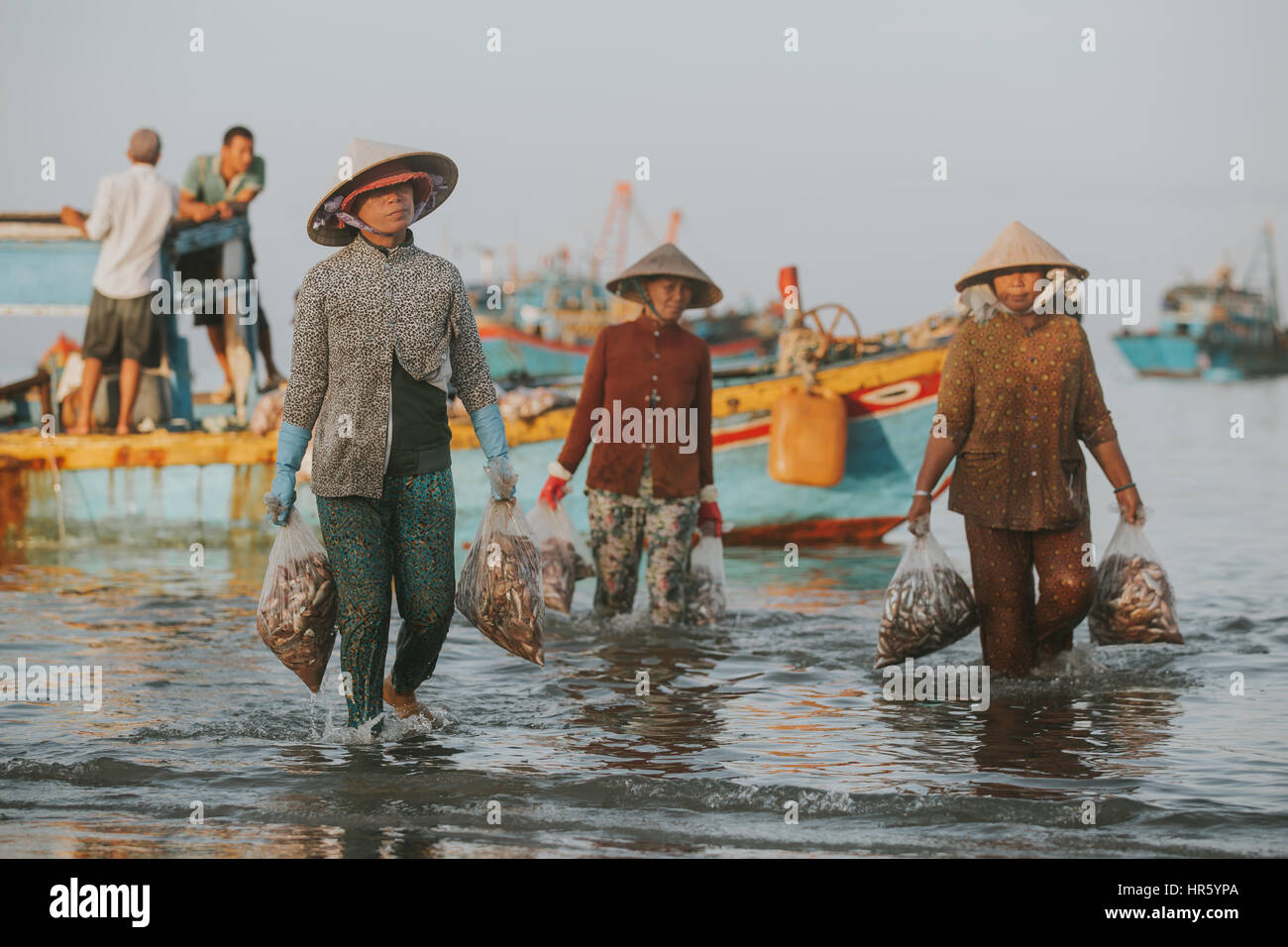 PHAN THIET, VIETNAM - November 9, 2016: Fishermen in Phan Thiet on November 9, 2016, Vietnam. Stock Photo