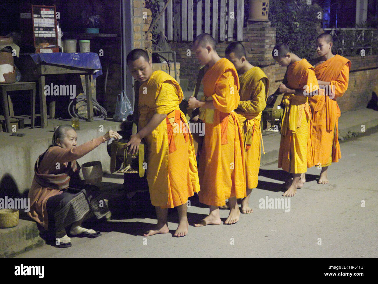 Laos, Luang Prabang, monks collecting alms, Stock Photo