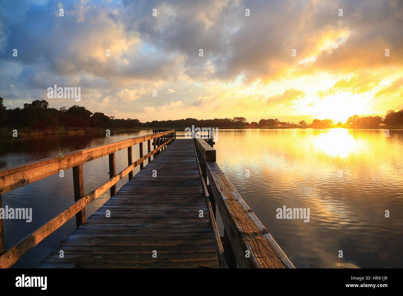 Sunset over the pier at Bass Pond on Kiawah Island, South Carolina. Stock Photo