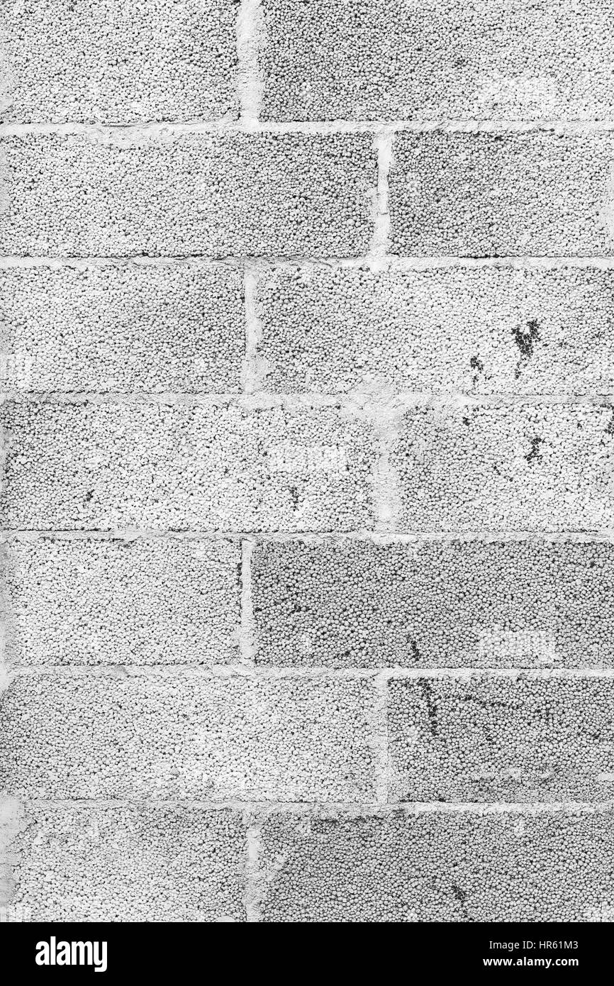 Close-up of a grey concrete block wall texture background in black&white. Stock Photo