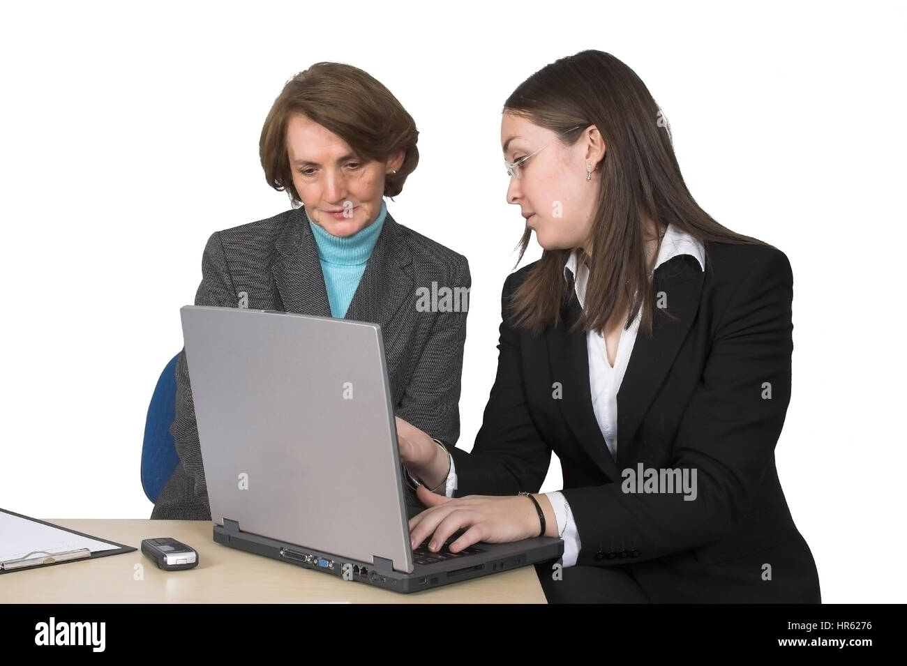 business female partners with laptop over a white background Stock Photo