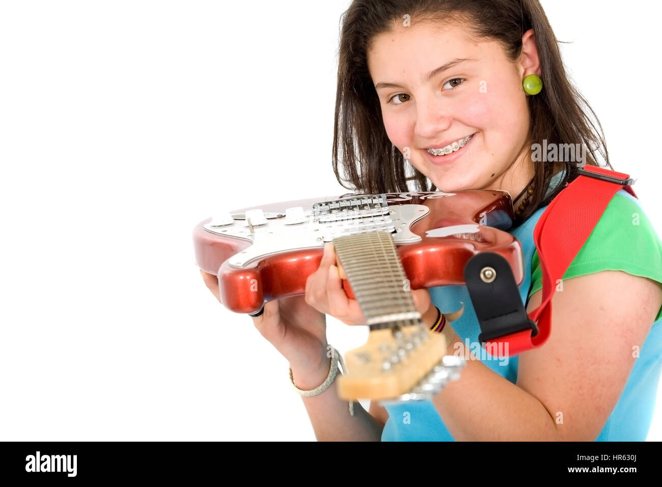 girl holding an electric guitar over a white background Stock Photo - Alamy