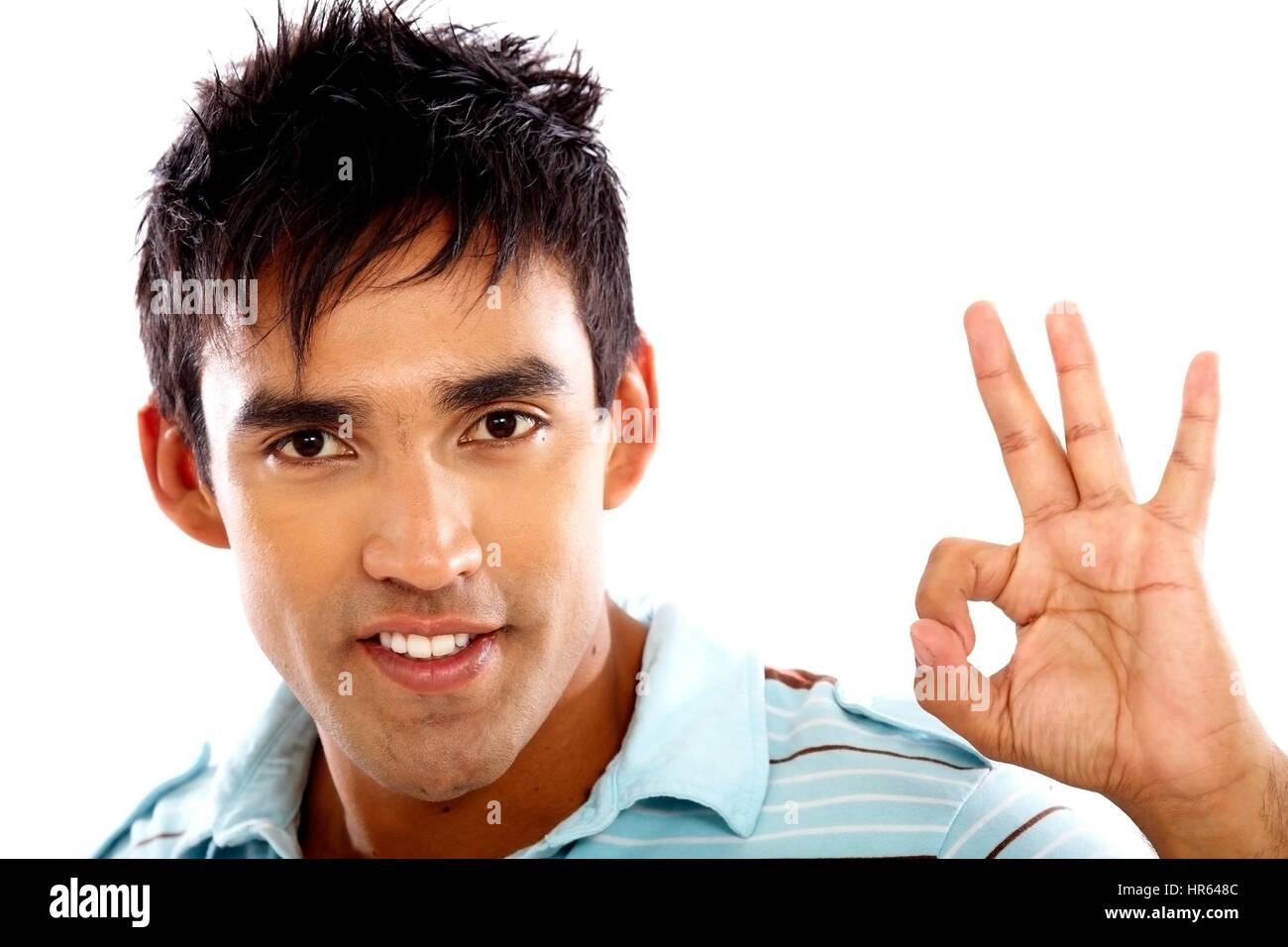 casual man doing the okay sign isolated over a white background Stock ...