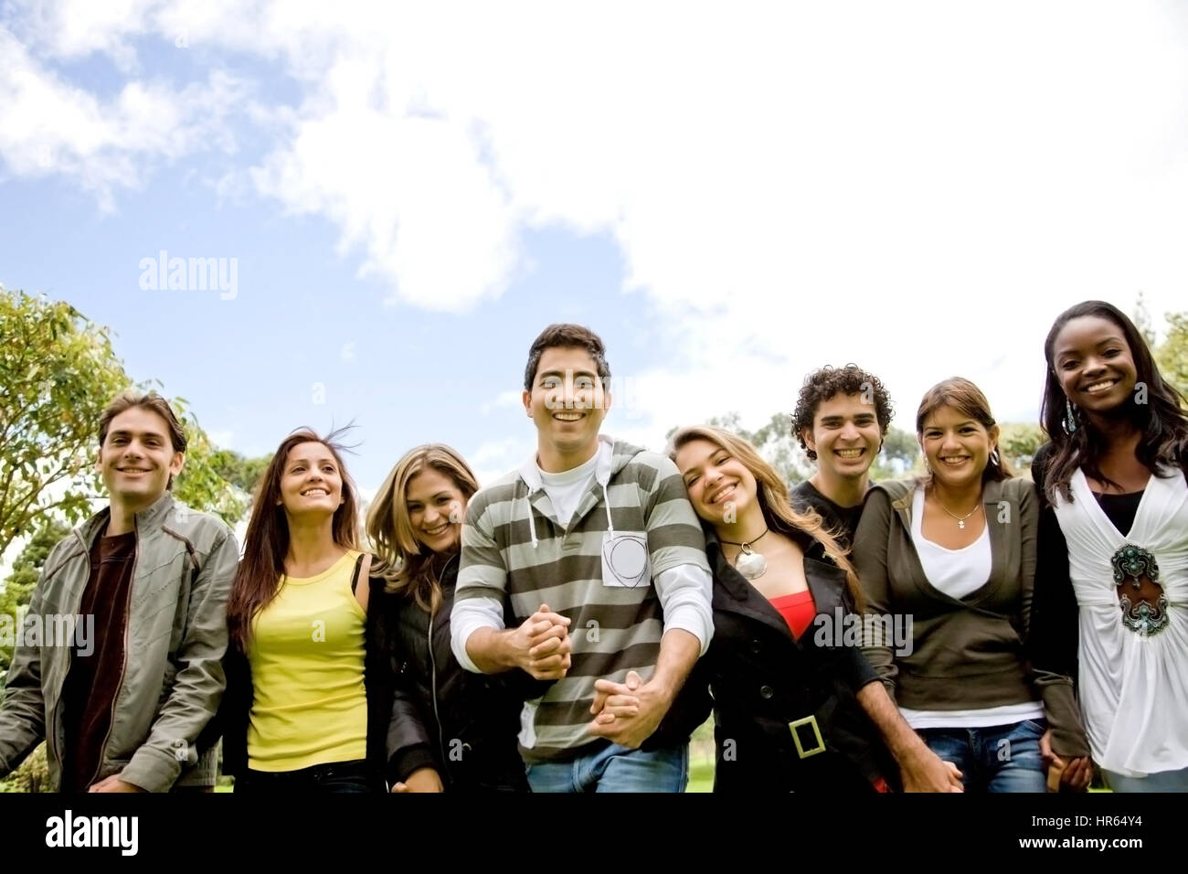 happy friends smiling outdoors in a park - diversity Stock Photo - Alamy