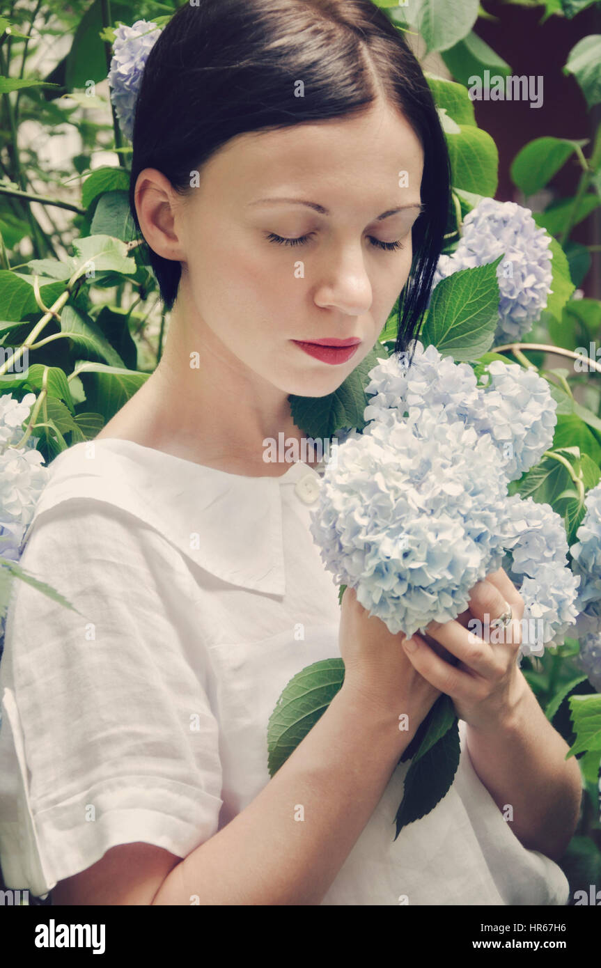 Woman holding flower Stock Photo