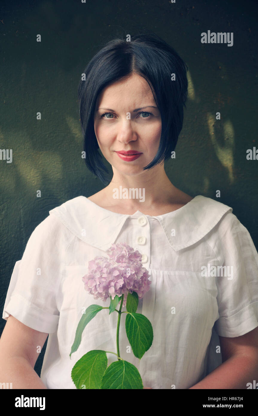 Woman holding flower Stock Photo