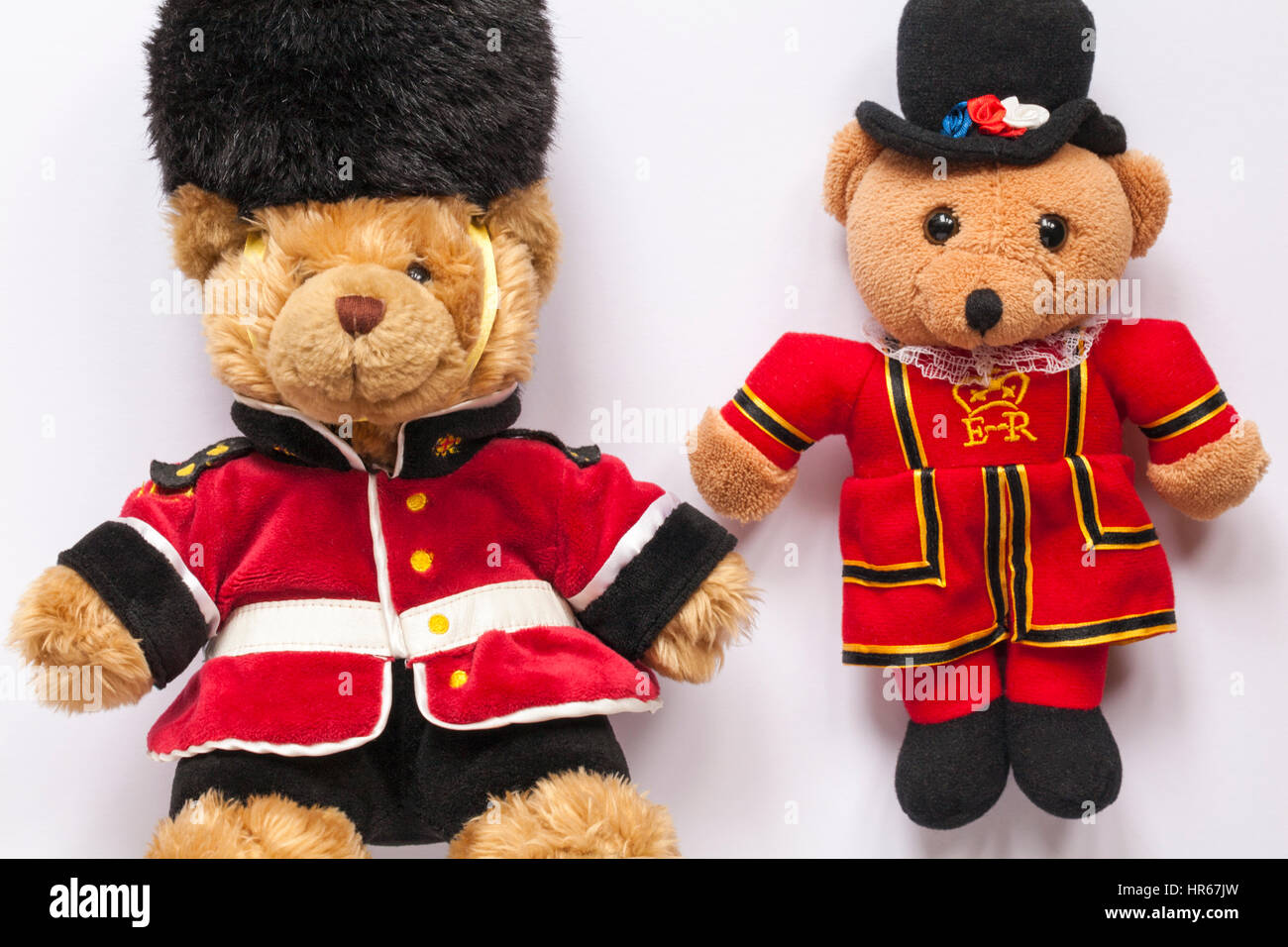 Buckingham Palace beefeater soldier guards, beefeater Yeoman of the Guard, Teddy bears soft cuddly toys set on white background Stock Photo