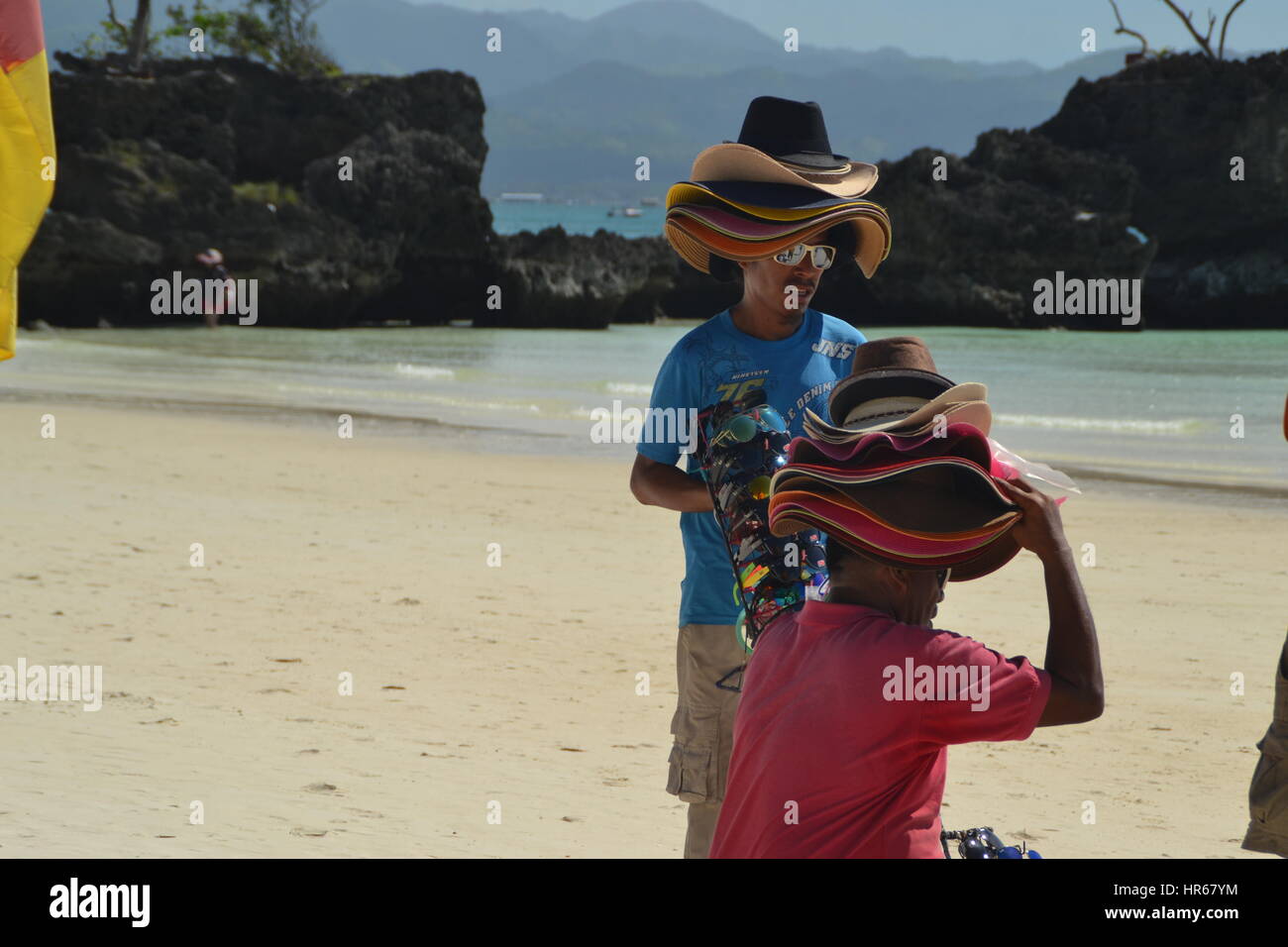 Man selling hats on beach hi-res stock photography and images - Alamy