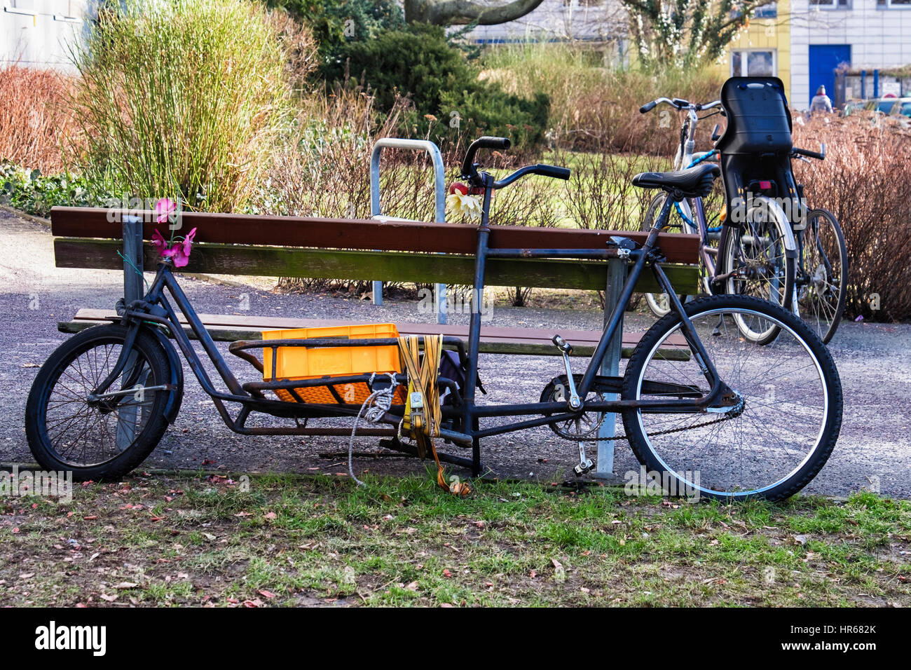 Elongated modified bicycle  with basket for carrying goods. Unusual bike modification.Delivery bicycle. Stock Photo