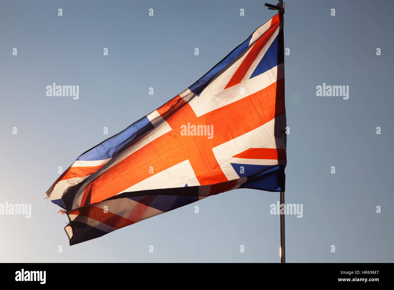 close up of Union Jack flag against blue sky Stock Photo - Alamy