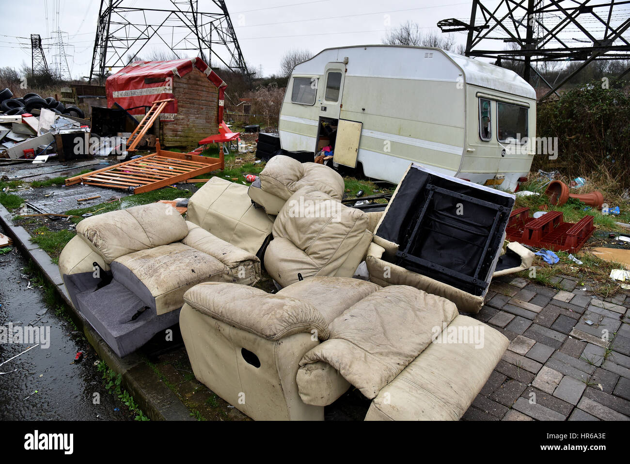Travellers site, Tatton Road, Newport, South Wales. Smashed up caravans and fly-tipping, black bags and human waste left on the site. Stock Photo