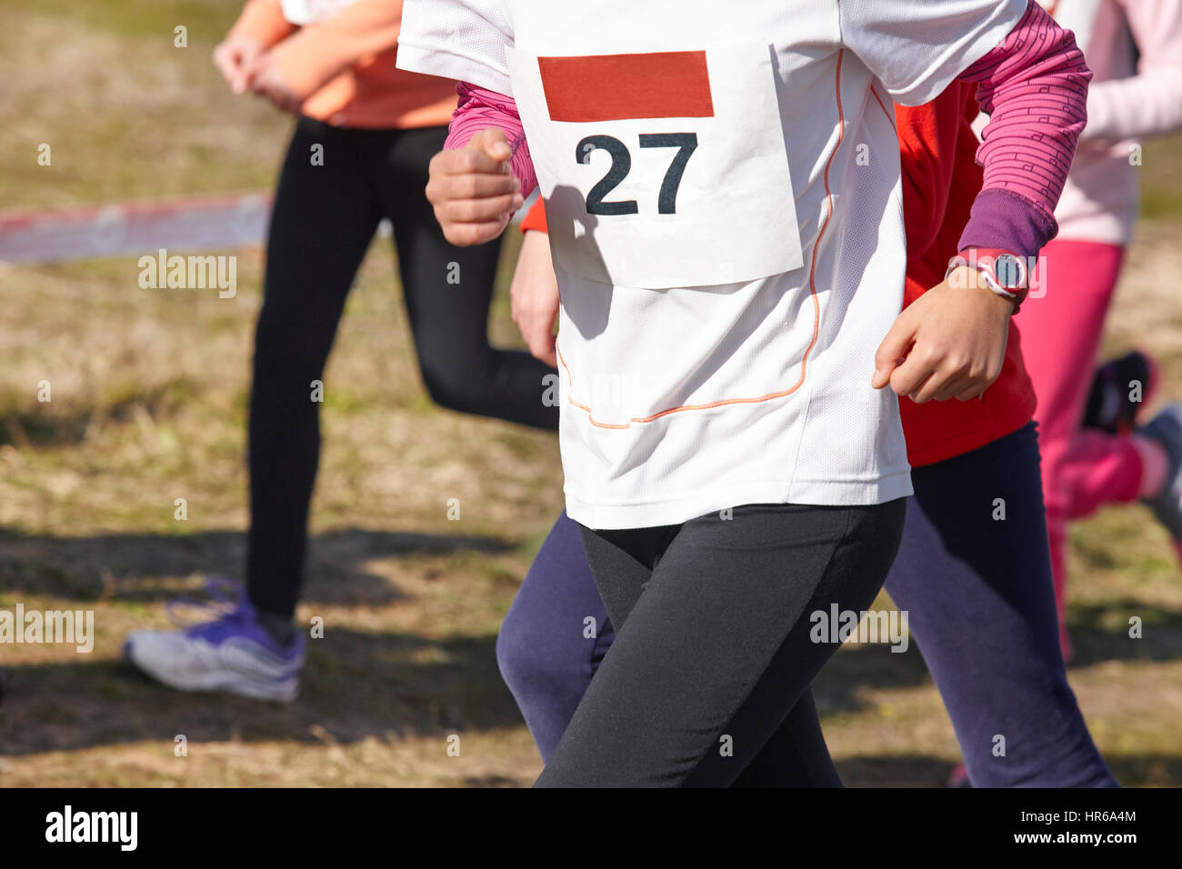 Junior athletic runners on a cross country race. Outdoor circuit. Horizontal Stock Photo Alamy