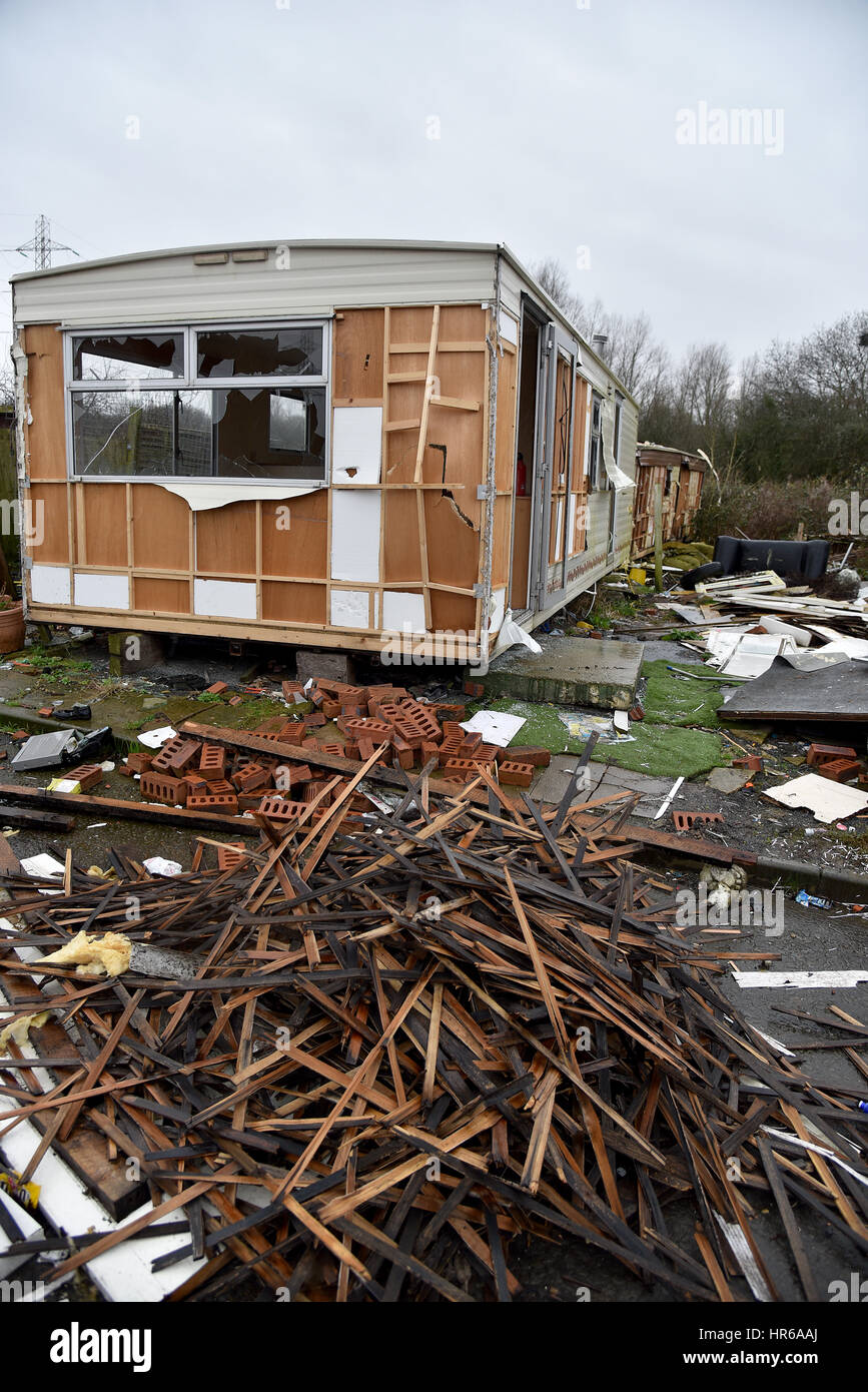 Travellers site, Tatton Road, Newport, South Wales. Smashed up caravans and fly-tipping, black bags and human waste left on the site. Stock Photo