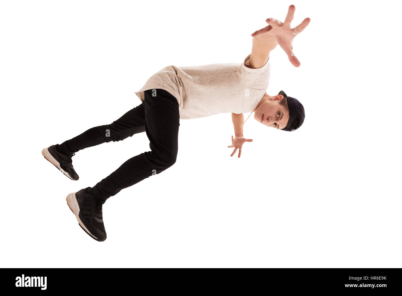 Portrait Of Young Handsome Man Showing Break Dance Movement In