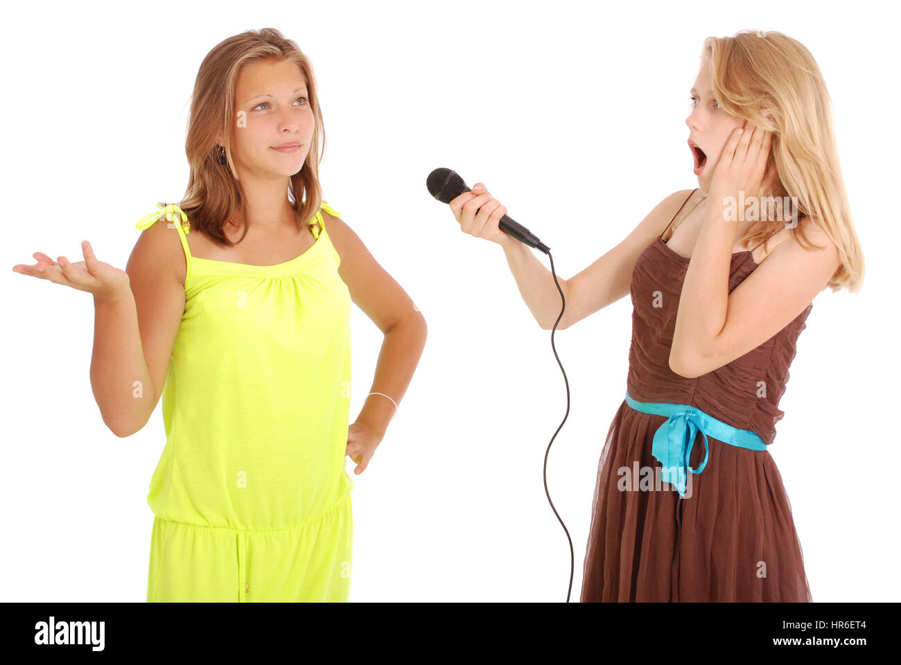 Young beautiful teenage girl conducts interviews with the singer. Isolated on white background Stock Photo