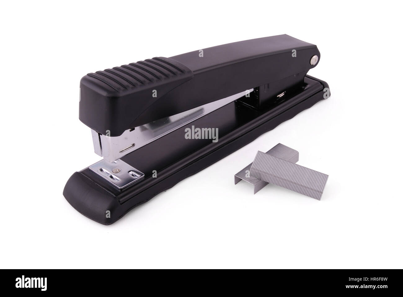 Office stapler for a paper fastening, black with metal inserts on a white background white background with soft shadow. Photo with clipping path Stock Photo