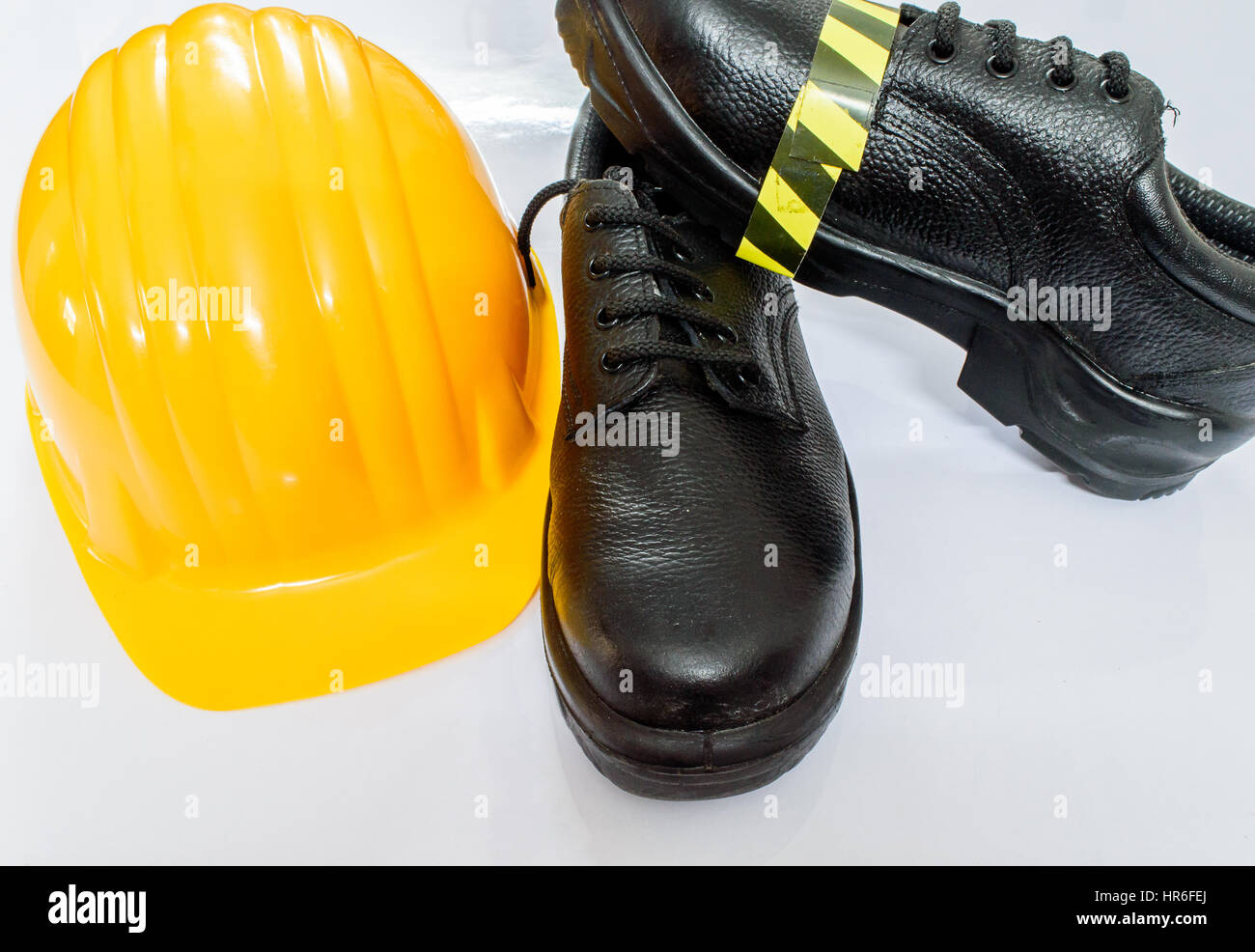 Industrial or Safety shoes and helmet with white glossy background ...