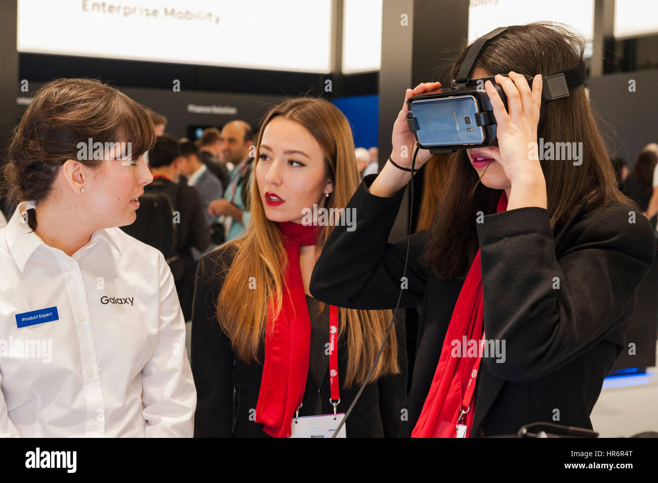 Barcelona, Spain. 27th Feb, 2017. A girl testing a Samsung Gear VR glasses during the Mobile World Congress wireless show in Barcelona. The annual Mobile World Congress hosts some of the world's largest communications companies, with many unveiling their latest phones and wearables gadgets. Credit: Charlie Perez/Alamy Live News Stock Photo