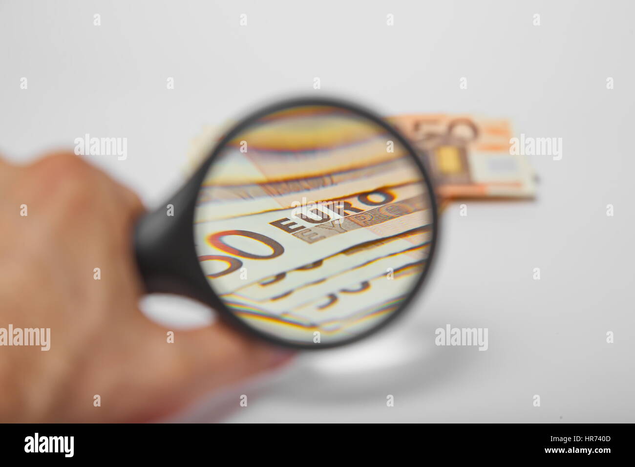 Magnifying Glass on the one hundred Euros Stock Photo