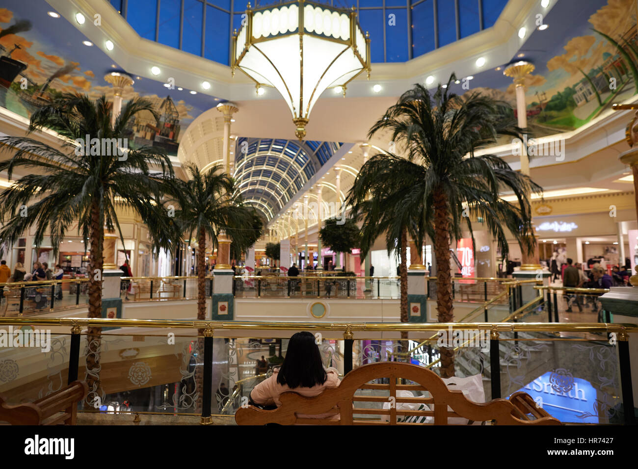 Evening inside interior of Trafford Centre showing large chandler light at shopping mall centre complex Dunplington, Manchester, England, UK. Stock Photo