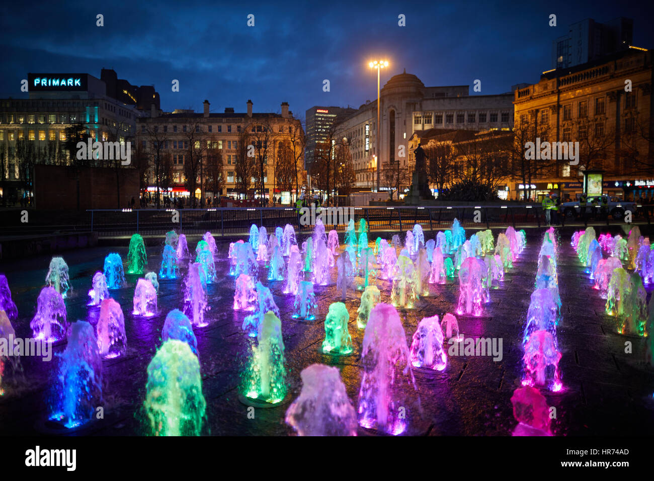 MANCHESTER City Centre, Piccadilly Gardens landmark water fountain display lights at night Stock
