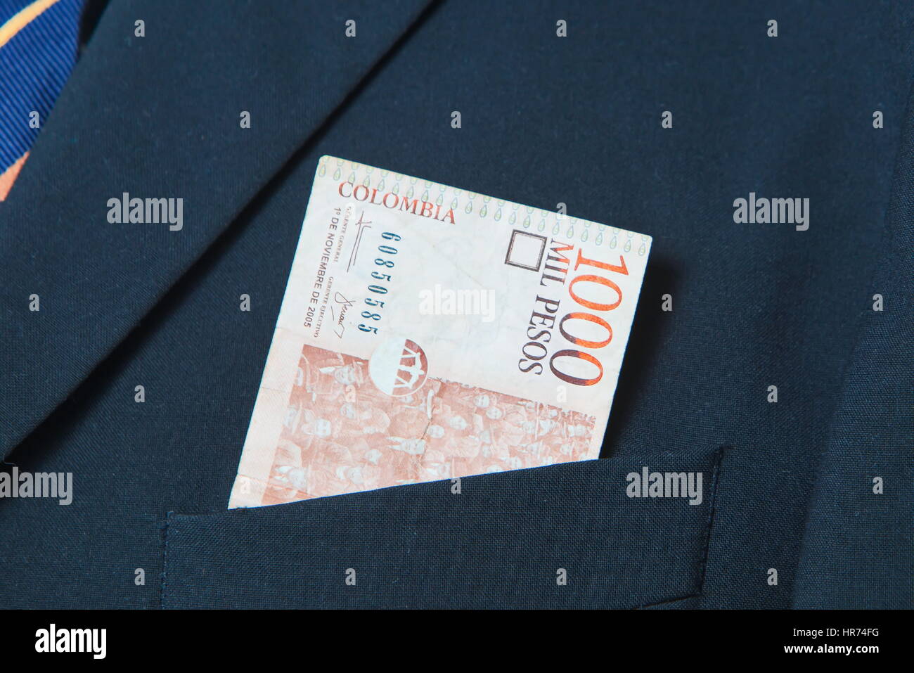 Colombian Pesos in the pocket of a suit Stock Photo