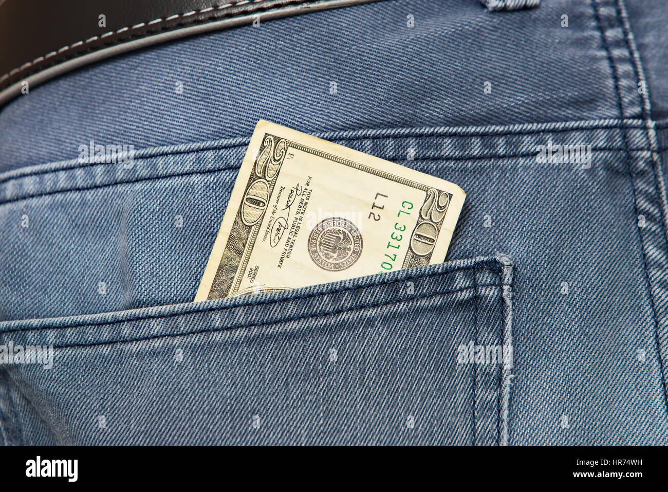 American dollar bills in jeans pocket background Stock Photo