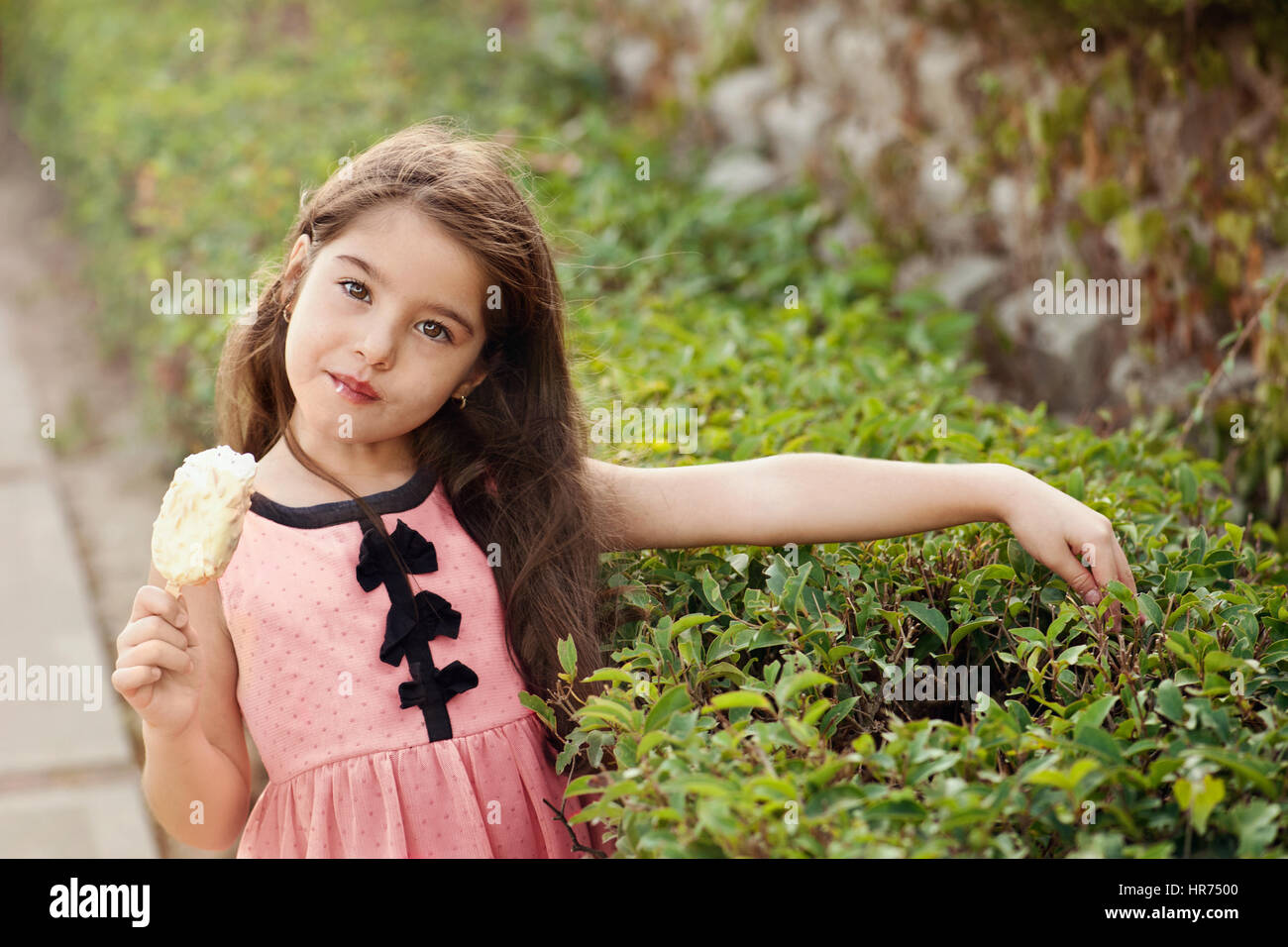 Child with ice cream looking at camera Stock Photo