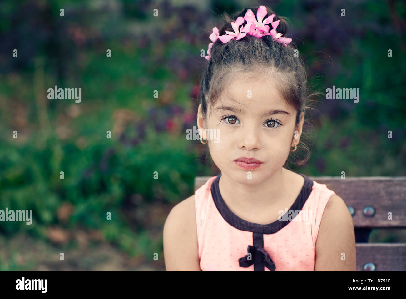 Portrait of little girl looking serious Stock Photo