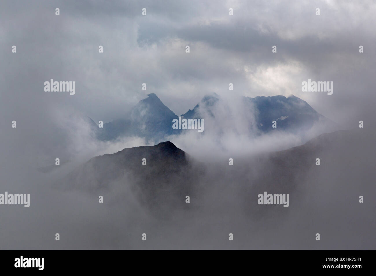 Mountain group with clouds, Hohe Tauern mountain range, Austria, Europe Stock Photo