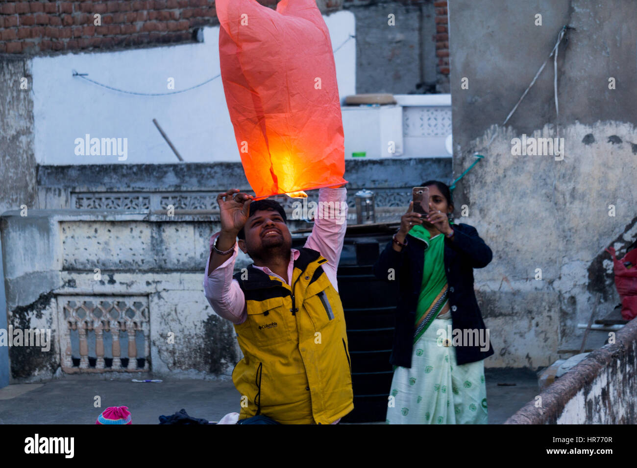 Jaipur, India 14th Jan 2017 Family launching a paper lantern from